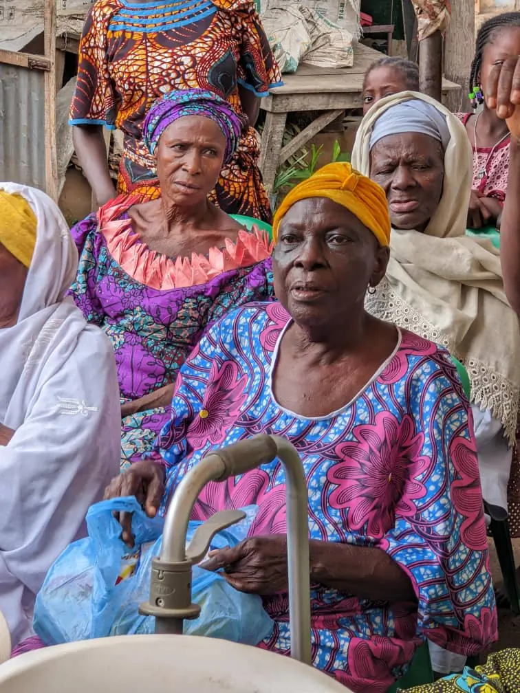 Elderly women receiving support from NCGI